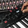 M-Audio Oxygen Pro 49 MIDI klaviatuurkontroller — 49 klahvi, 16 padja, 9 faderit, OLED-ekraan, USB, MIDI-väljund