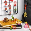 Seljakoti sõbrad võtmehoidjakomplekt Paladone Super Mario CDU 24 tk – erinevad tegelased, kogutavad aksessuaarid