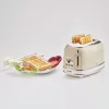 Ariete 155 Design 2 Slice Röstija võileivakorvidega, 6 röstimisastet, 810 W, roostevabast terasest korpus, eemaldatav purukauss, pastellbeež