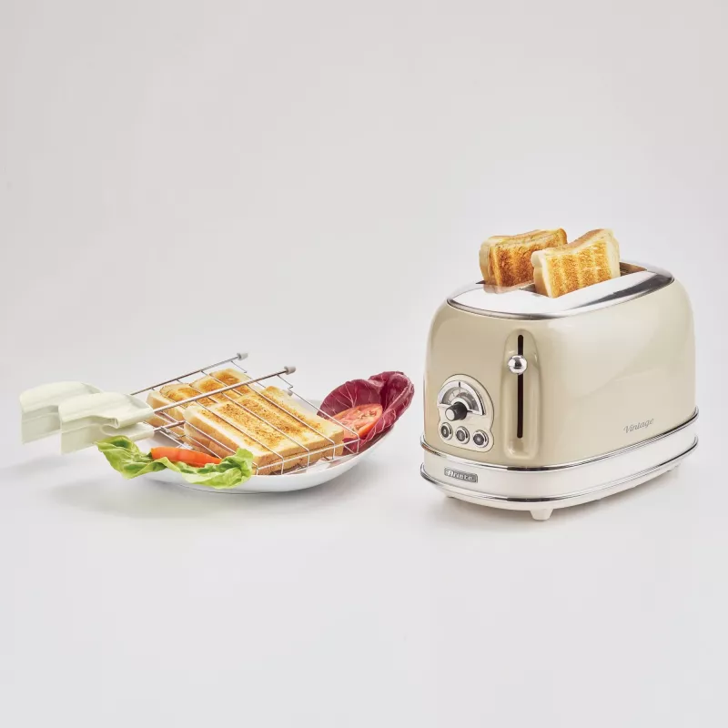 Ariete 155 Design 2 Slice Röstija võileivakorvidega, 6 röstimisastet, 810 W, roostevabast terasest korpus, eemaldatav purukauss, pastellbeež