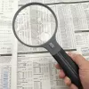 Suurendusklaas Carson Split Handle HF-11 — 3,5× käeshoitav luup, must/läbipaistev, AAA patarei